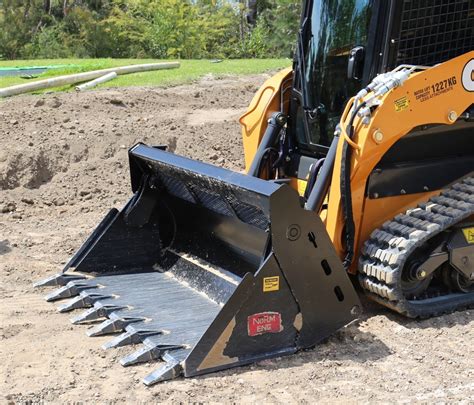 skid steer digging a ditch|skid steer bucket digging.